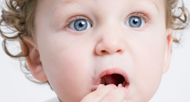 87825036 Head shot of toddler with surprised expression